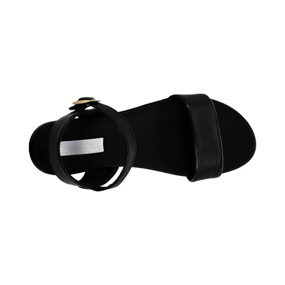 Sandales plates femme en cuir avec boucle réglable et silhouette minimaliste